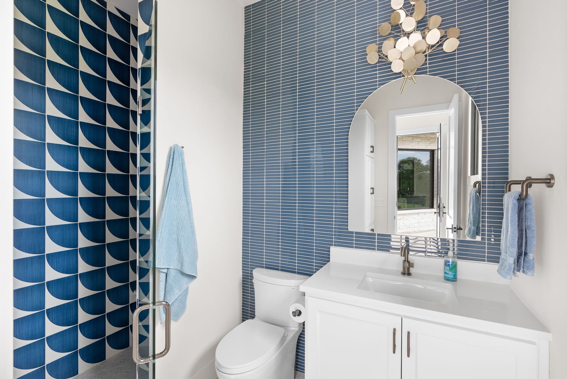 Sun Tile project photography with a blue tile accent wall