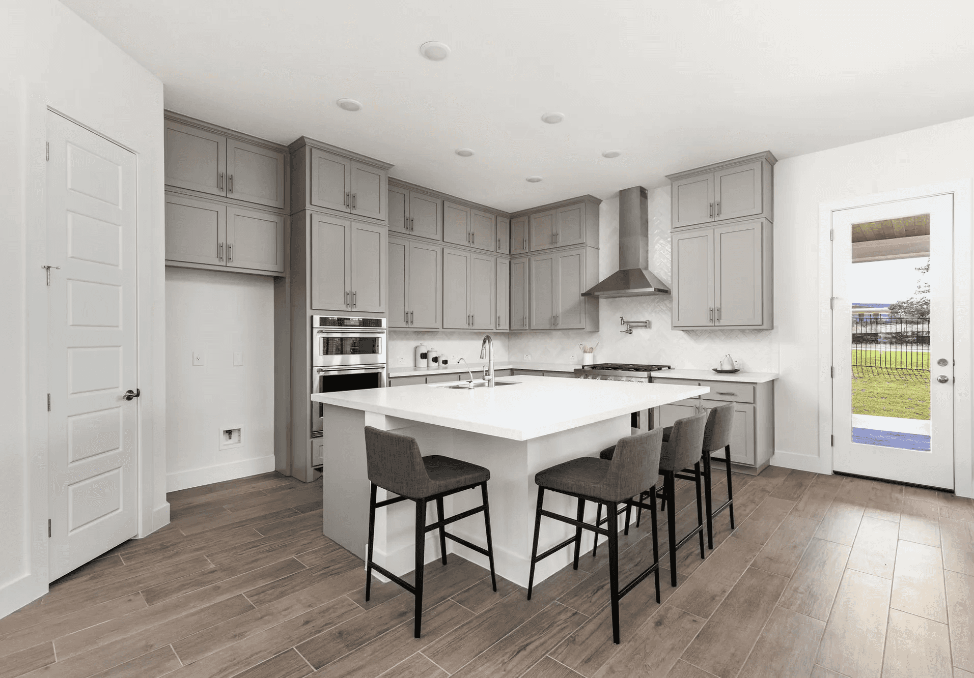 Kitchen with wood tile and tile backsplash