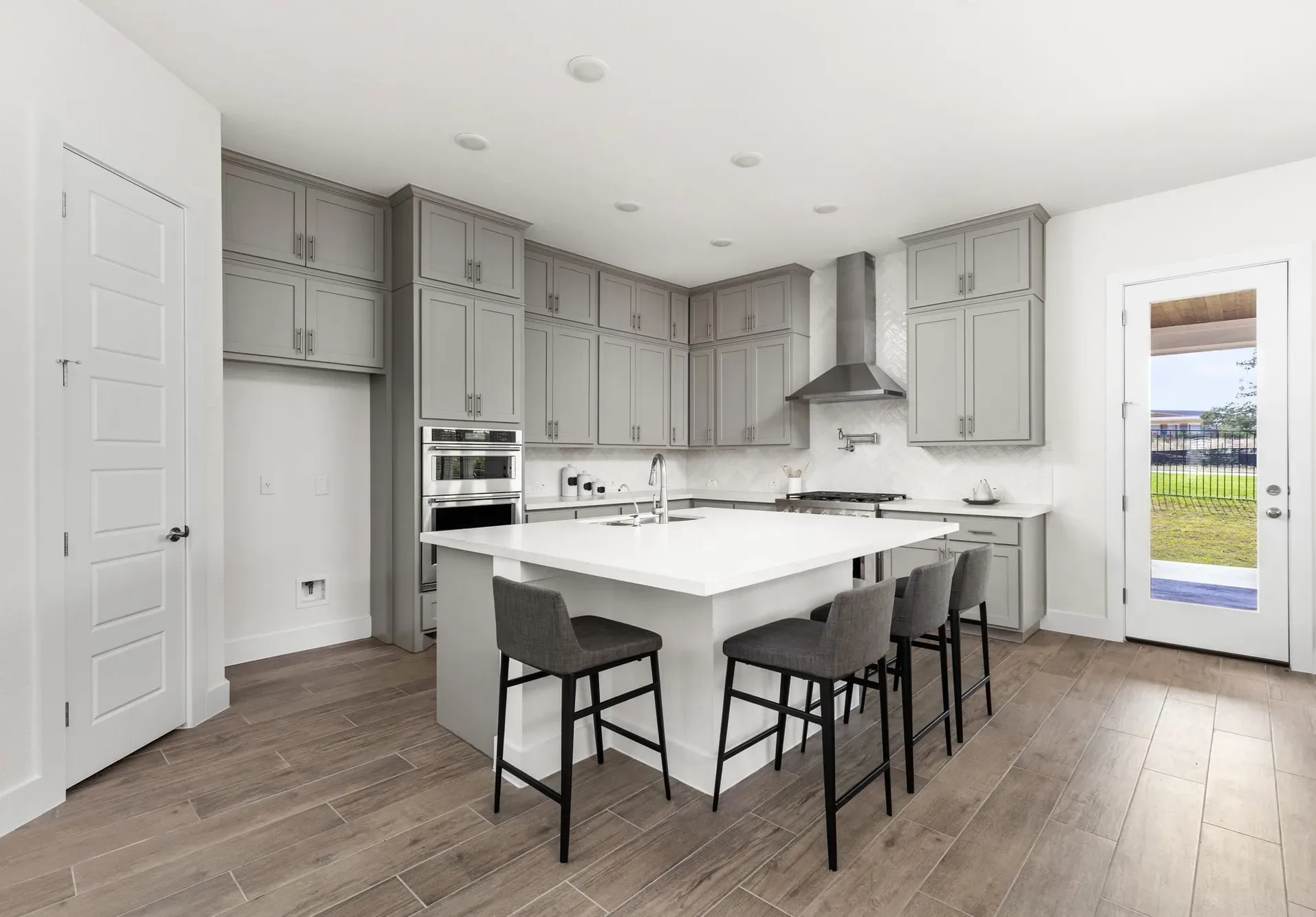 Sun Tile project: kitchen flooring and a tile backsplash