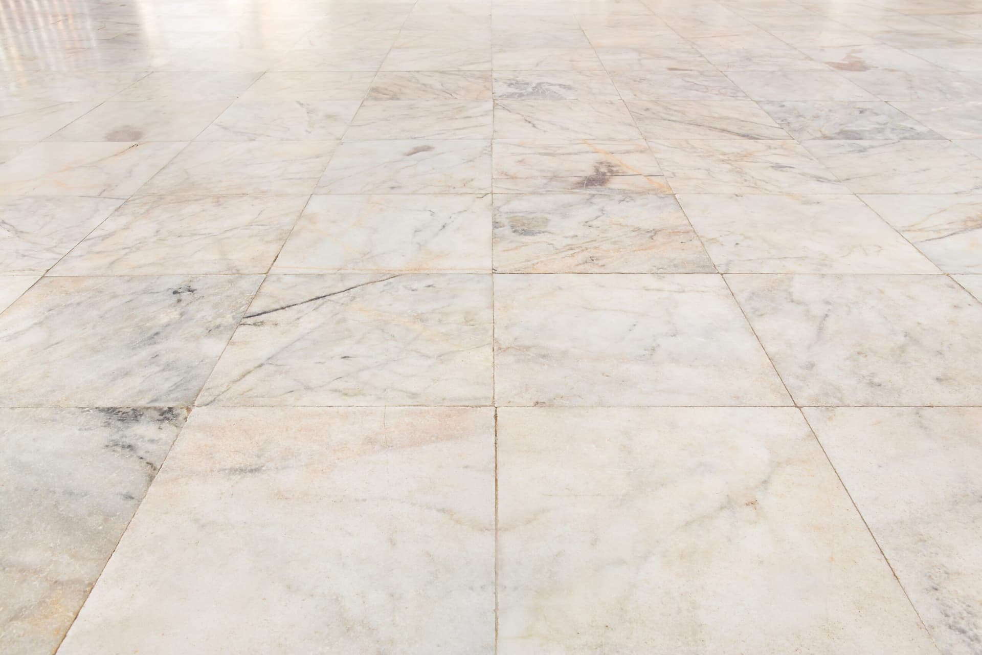 Close view of a tiled surface showing individual pieces and joints